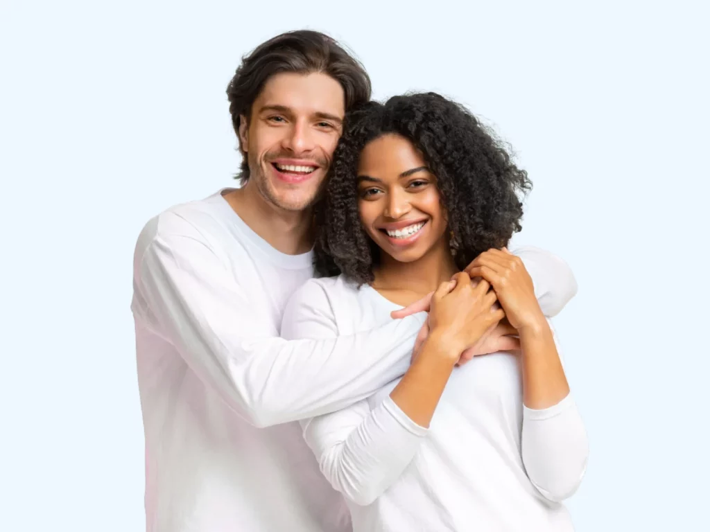young couple smiling with white teeth
